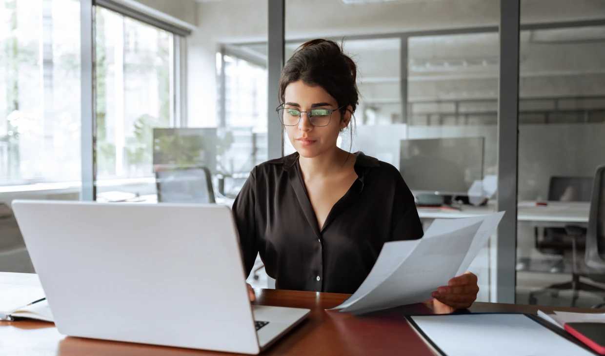 Woman working on laptop in office