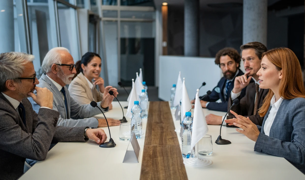 Corporate executives in formal meeting setting