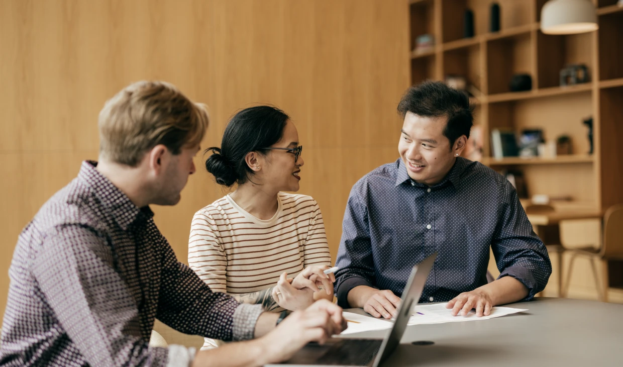 Colleagues discussing at a table